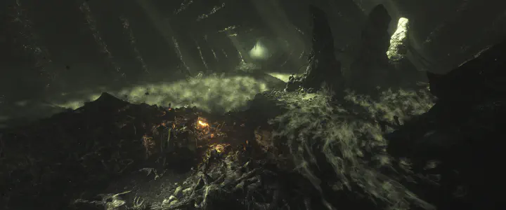 Game screenshot of Amicia, Hugo and Lucas wade through a dark cave, with a torch for light, surrounded by decomposed bodies, creepy mist and thousands of rats.